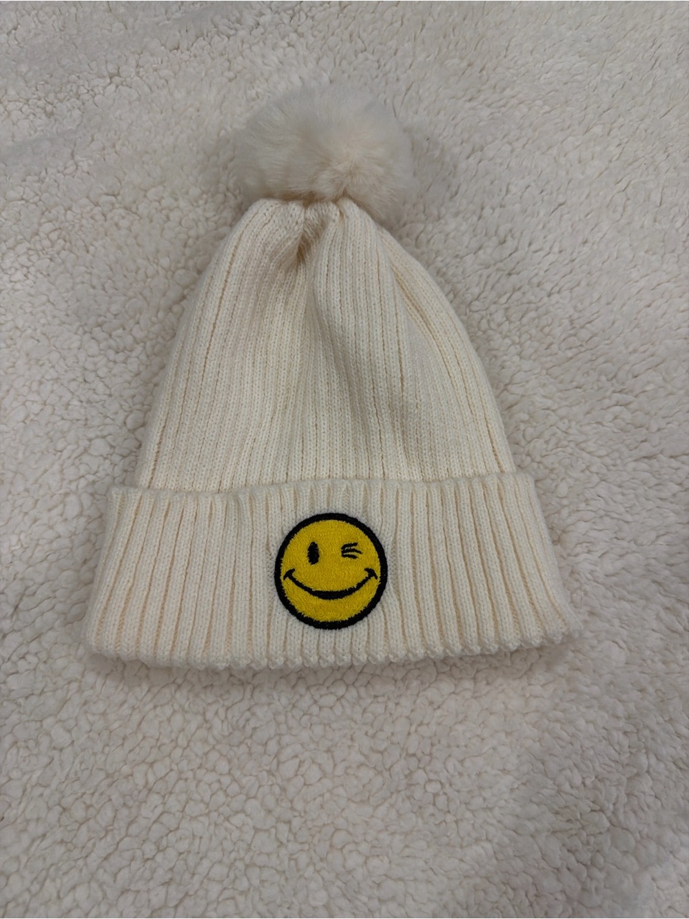 Kids Cream Pom Beanie with Winking Smiley Patch